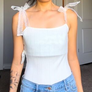 Brand new white Altar’d State body suit. Tie ribbon shoulder straps.
